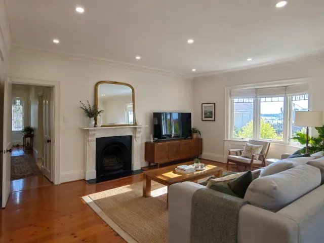 Living room ceiling with recessed downlights, fireplace, TV and bay window in Vaucluse